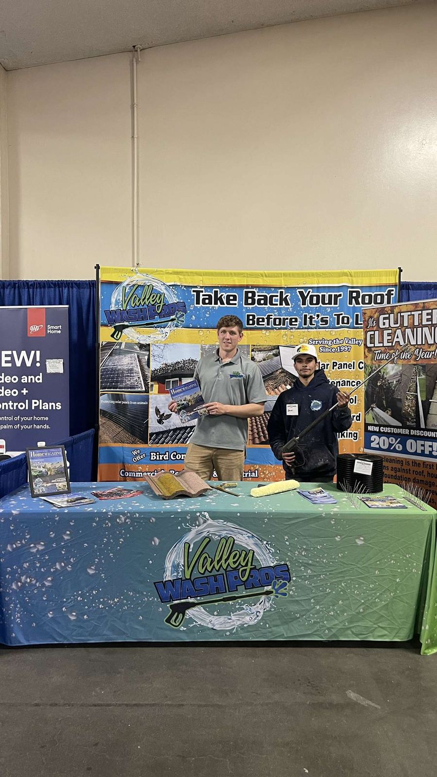 Valley Wash Pros bird control and roof cleaning display at a home show booth