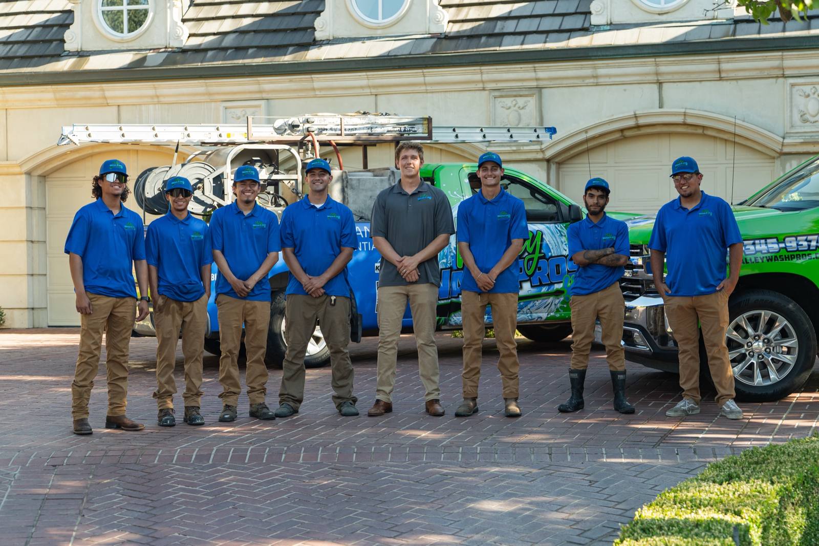 Valley Wash Pros crew preparing exterior cleaning equipment in Fresno, California