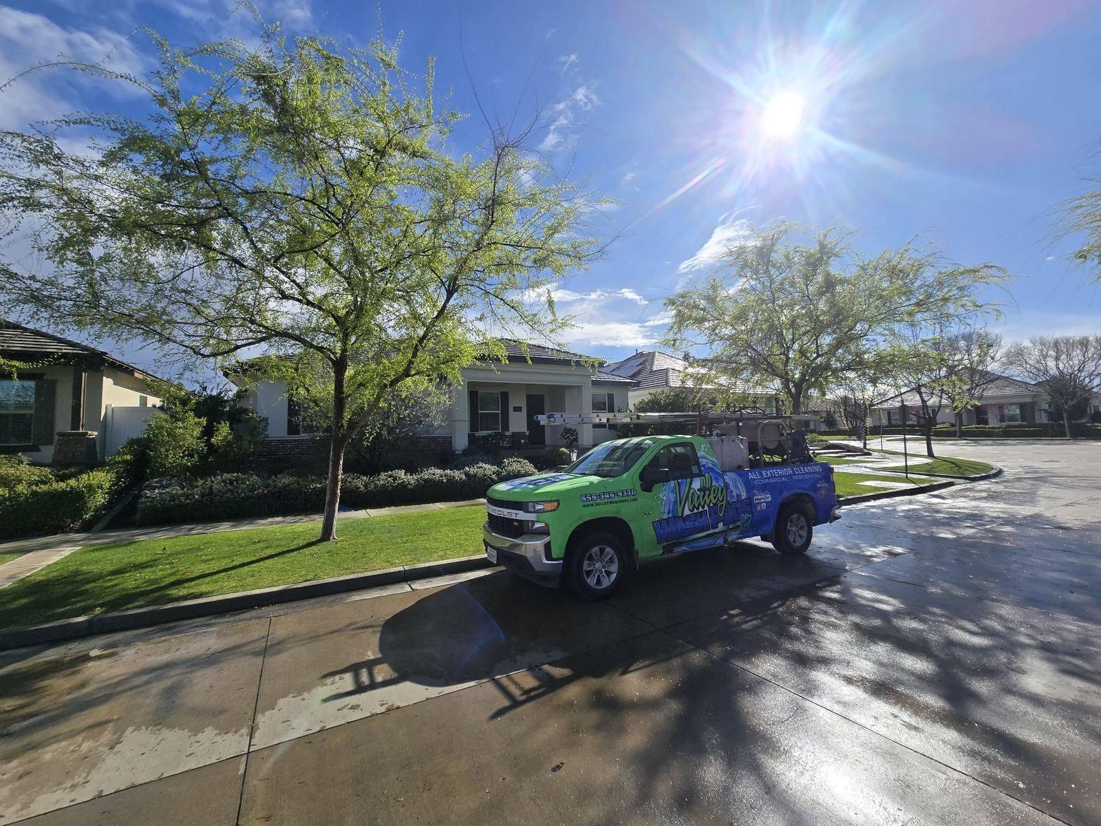 Valley Wash Pros truck on a freshly washed concrete driveway at the end of a Fresno build